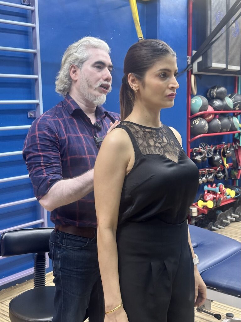 Dr Showing Showing Postural Correction for rounded shoulders 